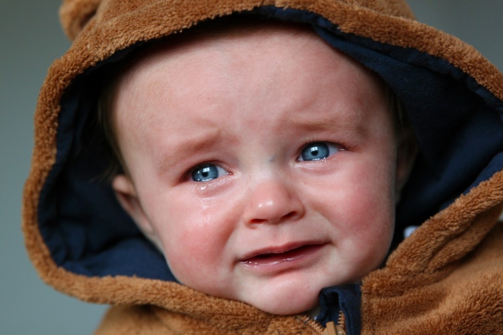 portrait-of-crying-baby-boy-with-blue-eyes
